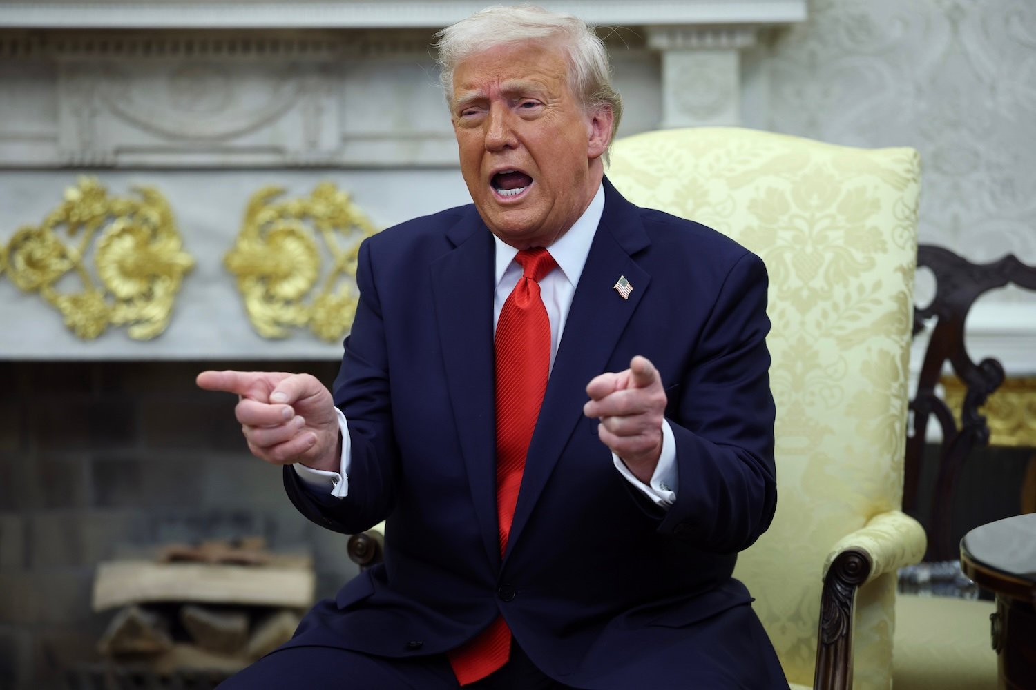 President Donald Trump gestures as he meets with President Nayib Bukele of El Salvador in the Oval Office of the White House April 14, 2025 in Washington, DC.