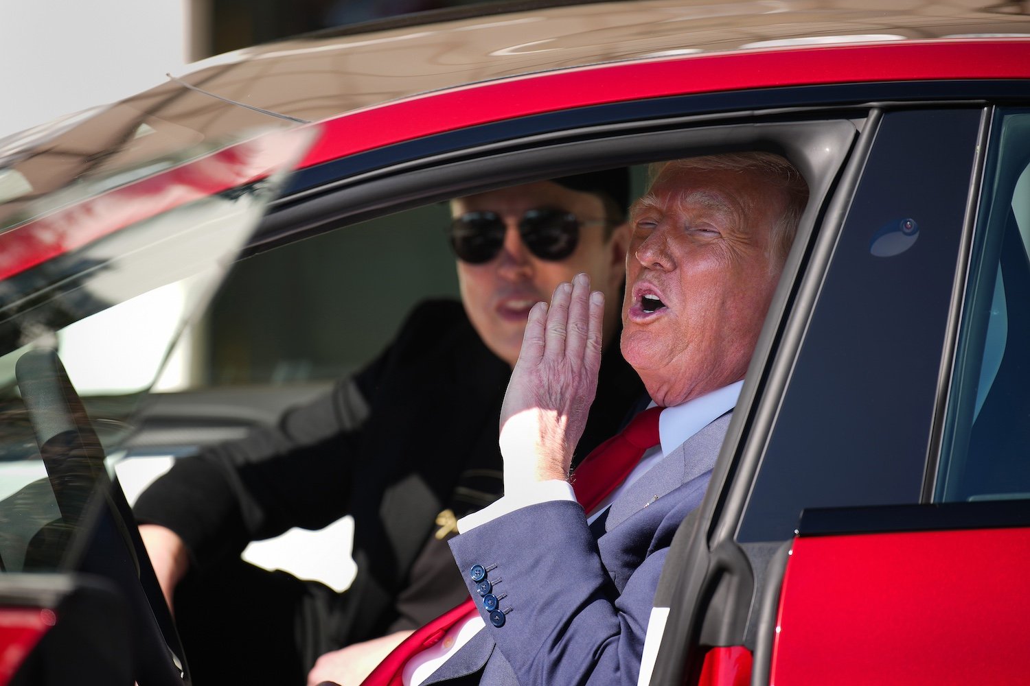 Elon Musk and Donald Trump in a Tesla