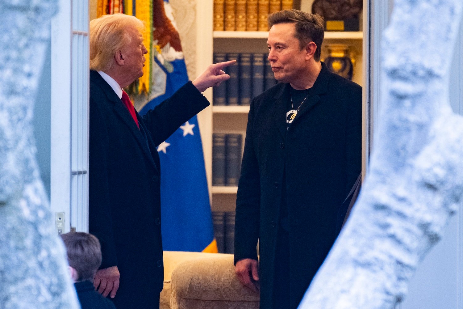 Donald Trump and Elon Musk speak in the Oval Office before departing the White House on his way to his South Florida home in Mar-a-Lago in Florida on March 14, 2025.