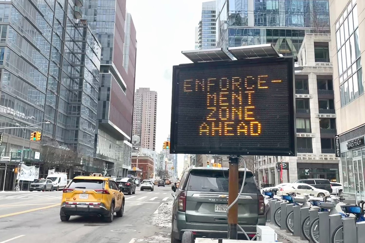 A sign reads "Enforcement Zone Ahead" on a street in New York City where congestion pricing is enforced.