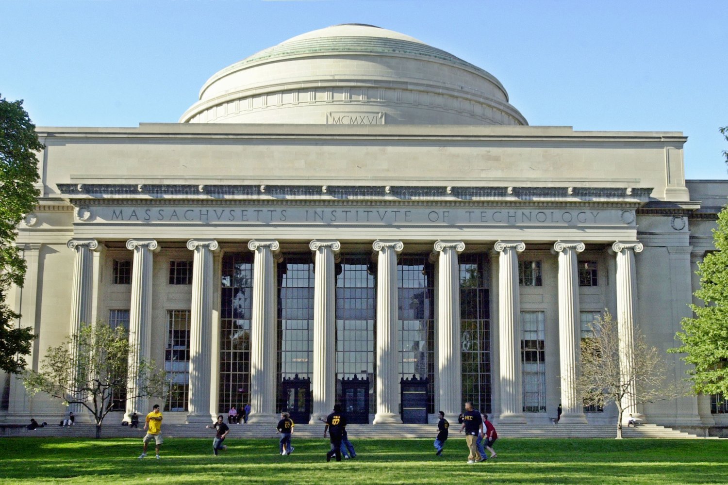 Massachusetts Institute of Technology students play football outside the Maclaurin Building
