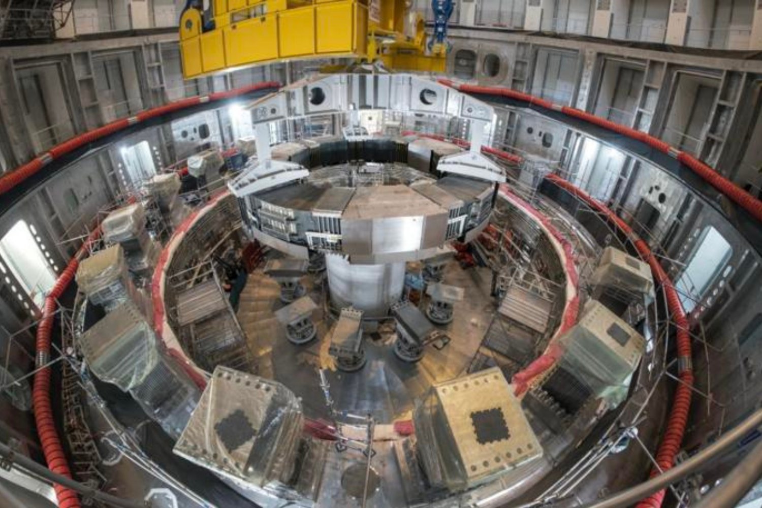 Installation of the first superconducting magnet, Poloidal Field Coil #6.