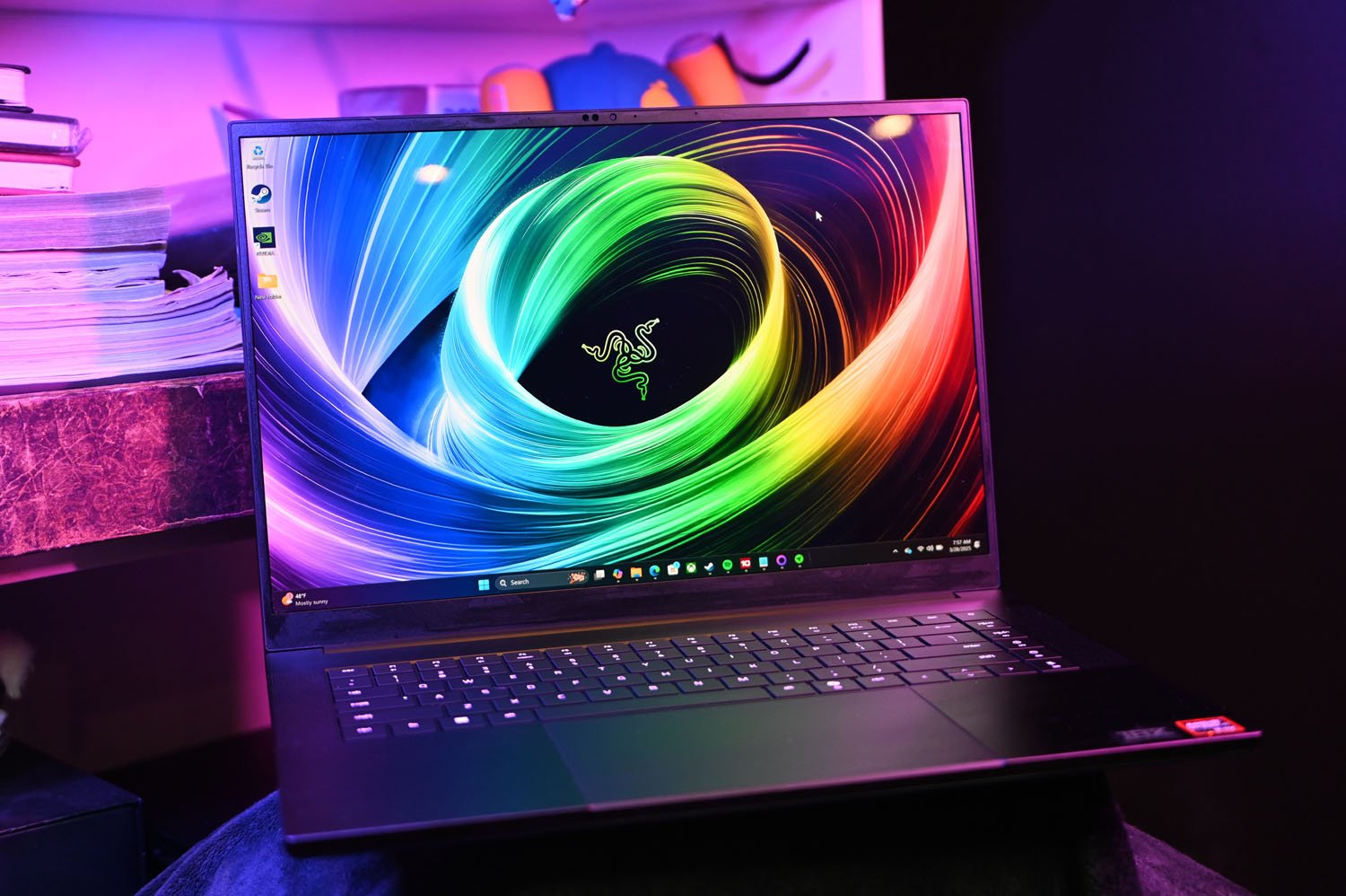 Razer Blade 16 2025 in front of a white bookcase
