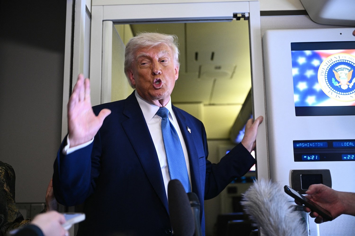 Donald Trump speaks to members of the media accompanying him aboard Airforce One, after leaving Abu Dhabi at the end of his Middle East tour on May 16, 2025.